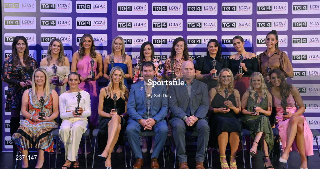 4 November 2022; The 2022 TG4 Intermediate Team of the Championship, front row, from left, Eimear Barry of Laois, Sarah Harding Kenny of Wexford, Aisling Donoher of Laois, Mícheál Naughton, LGFA President, and Rónán Ó Coisdealbha, Head of Sport, TG4, Tara Kelly of Clare, Rachel Williams of Laois, and Fidelma Marrinan of Clare, back row, from left, Róisín Murphy of Wexford, Ellen Healy of Laois, Aisling Reidy of Clare Laura Fleming of Roscommon, Caitríona Murray of Wexford, Laura-Marie Maher of Laois, Erone Fitzpatrick of Laois, Mo Nerney of Laois and Aisling Murphy of Wexford, at the 2022 TG4 Teams of the Championship awards night at Croke Park, Dublin. Photo by Seb Daly/Sportsfile