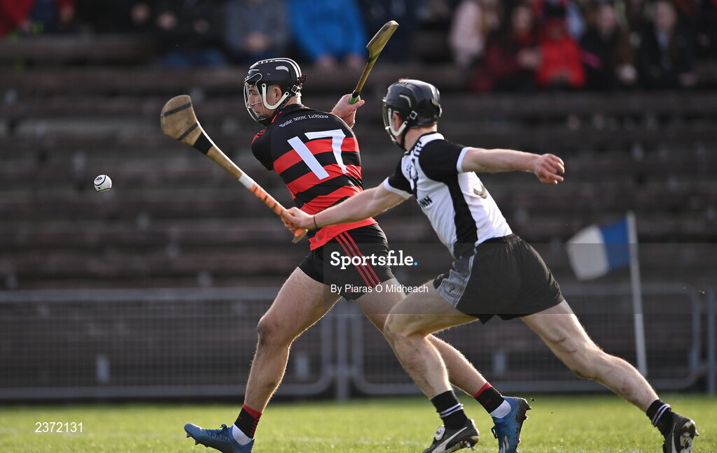 6 November 2022; Harry Ruddle of Ballygunner shoots to score his side's third goal as Jerome Cahill of Kilruane MacDonagh's moves to tackle during the AIB Munster GAA Hurling Senior Club Championship quarter-final match between Ballygunner and Kilruane MacDonagh's at Walsh Park in Waterford. Photo by Piaras Ó Mídheach/Sportsfile