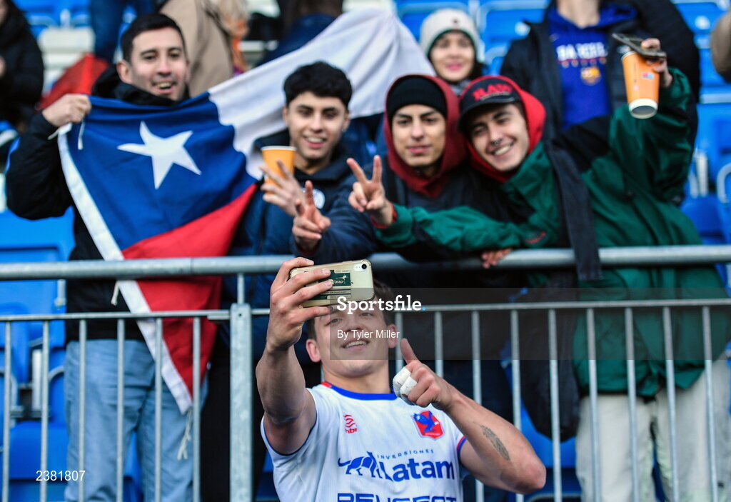 18 November 2022; Chile supporters take a photo with Santiago Videla of Chile after the Bank of Ireland friendly match between Leinster and Chile at Energia Park in Dublin. Photo by Tyler Miller/Sportsfile