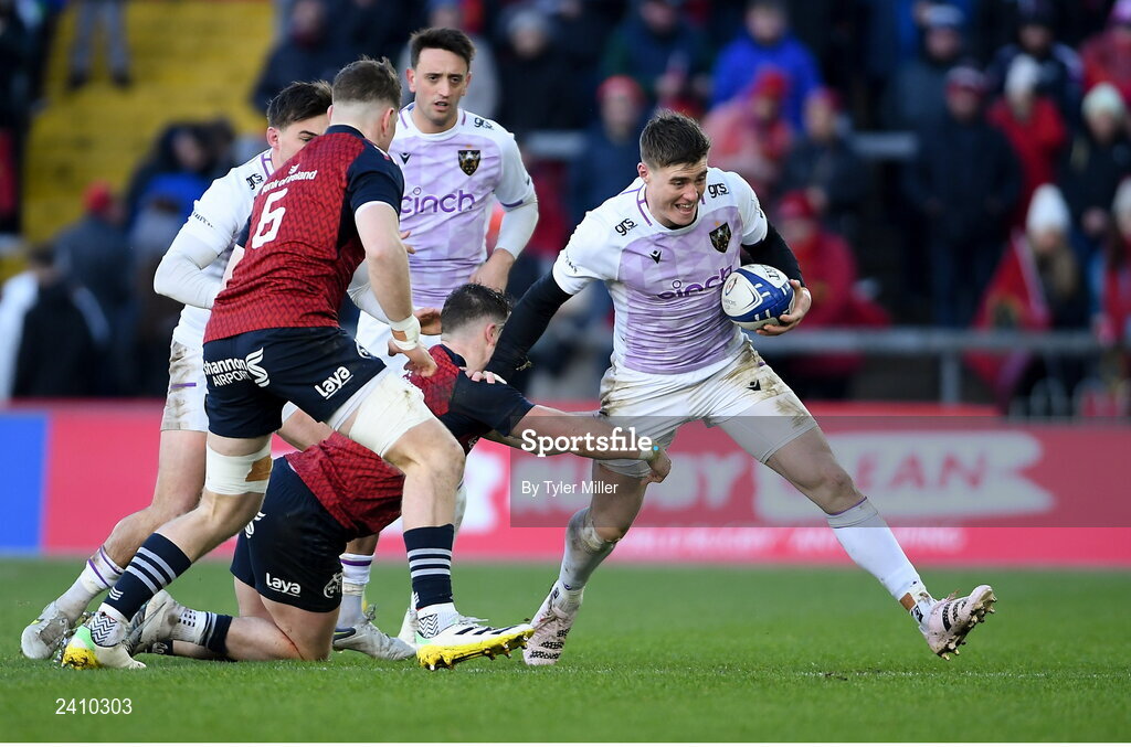 14 January 2023; Tommy Freeman of Northampton Saints evades the tackle of Calvin Nash of Munster during the Heineken Champions Cup Pool B Round 3 match between Munster and Northampton Saints at Thomond Park in Limerick. Photo by Tyler Miller/Sportsfile