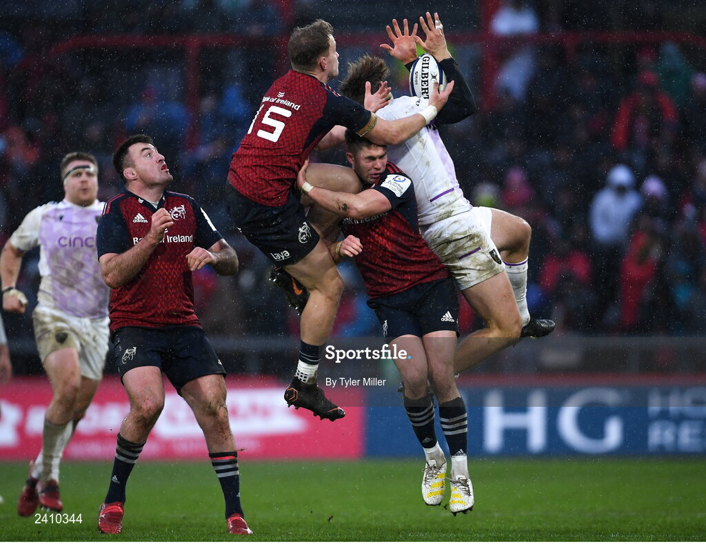 14 January 2023; James Ramm of Northampton Saints, right, battles for possession against Mike Haley, left, and Jack Crowley of Munster during the Heineken Champions Cup Pool B Round 3 match between Munster and Northampton Saints at Thomond Park in Limerick. Photo by Tyler Miller/Sportsfile
