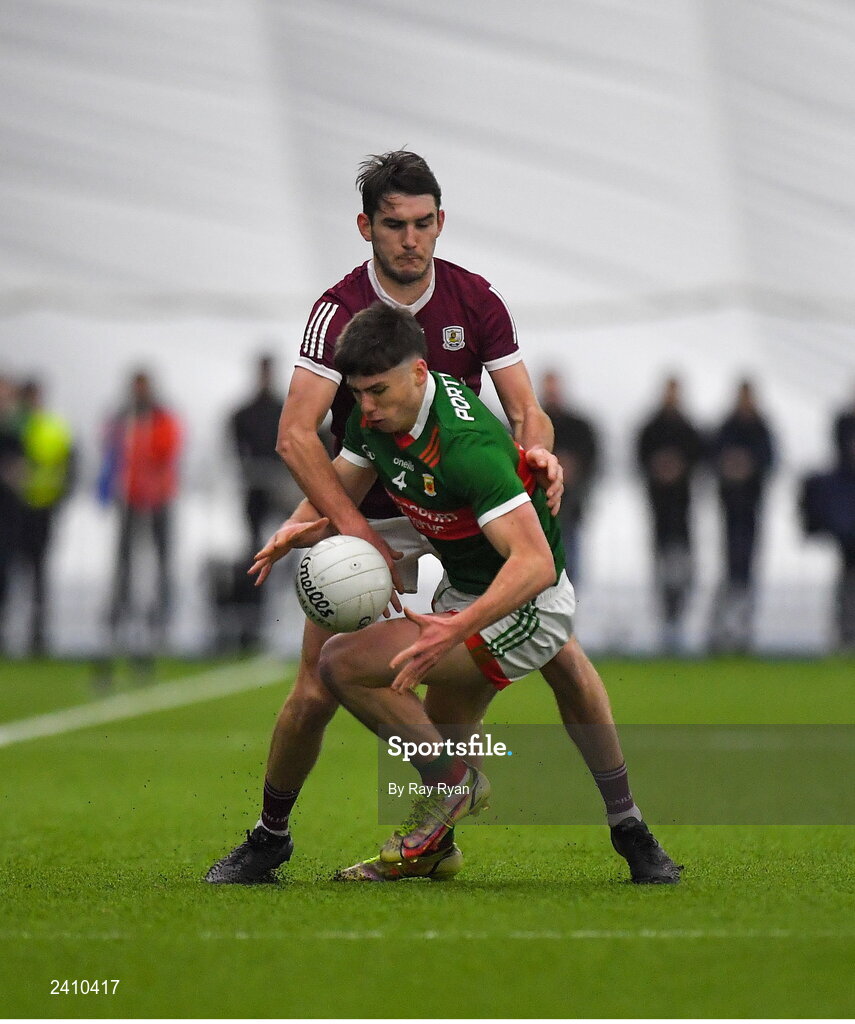 14 January 2023; Sam Callinan of Mayo in action against Barry McHugh of Galway during the Connacht FBD League Semi-Final match between Mayo and Galway at NUI Galway Connacht GAA Air Dome in Bekan, Mayo. Photo by Ray Ryan/Sportsfile