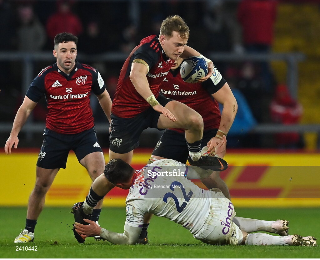 14 January 2023; Mike Haley of Munster steps over the tackle of Fraser Dingwall of Northampton Saints during the Heineken Champions Cup Pool B Round 3 match between Munster and Northampton Saints at Thomond Park in Limerick. Photo by Brendan Moran/Sportsfile