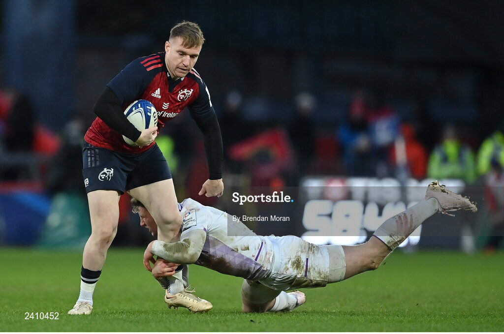 14 January 2023; Rory Scannell of Munster is tackled by Fraser Dingwall during the Heineken Champions Cup Pool B Round 3 match between Munster and Northampton Saints at Thomond Park in Limerick. Photo by Brendan Moran/Sportsfile
