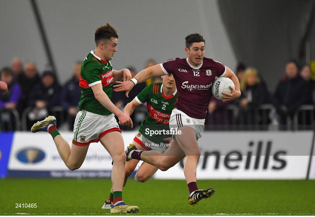 14 January 2023; Johnny Heaney of Galway in action against Fenton Kelly of Mayo during the Connacht FBD League Semi-Final match between Mayo and Galway at NUI Galway Connacht GAA Air Dome in Bekan, Mayo. Photo by Ray Ryan/Sportsfile