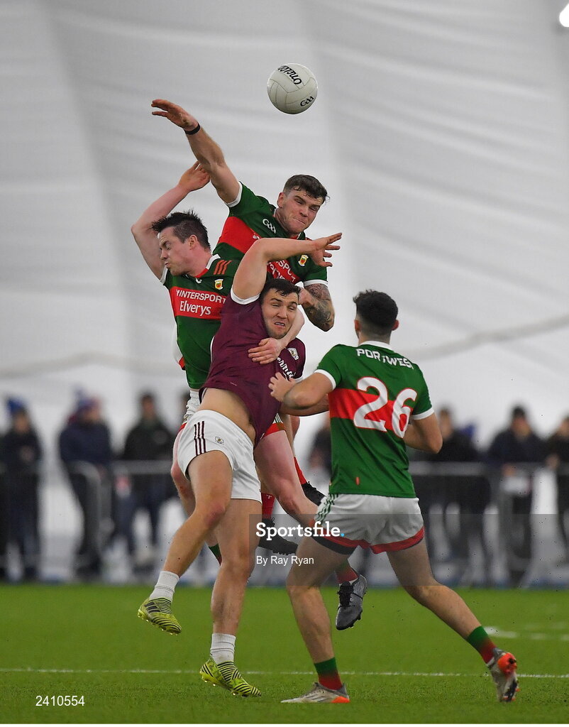 14 January 2023; Damien Comer of Galway in action against Jordan Flynn and Stephen Coen of Mayo during the Connacht FBD League Semi-Final match between Mayo and Galway at NUI Galway Connacht GAA Air Dome in Bekan, Mayo. Photo by Ray Ryan/Sportsfile