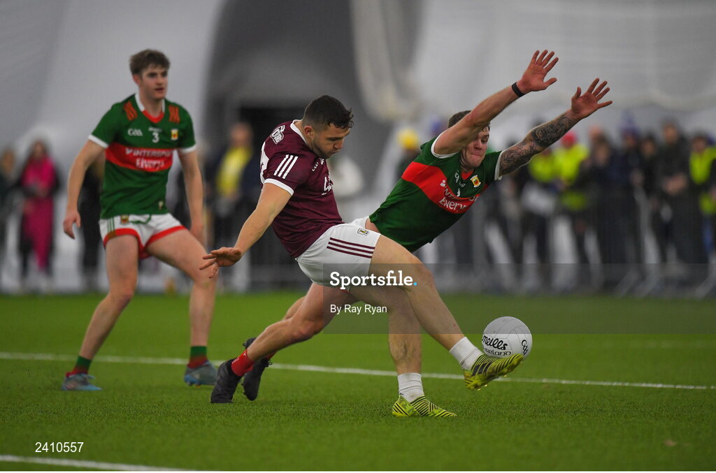 14 January 2023; Damien Comer of Galway in action against Jordan Flynn of Mayo during the Connacht FBD League Semi-Final match between Mayo and Galway at NUI Galway Connacht GAA Air Dome in Bekan, Mayo. Photo by Ray Ryan/Sportsfile