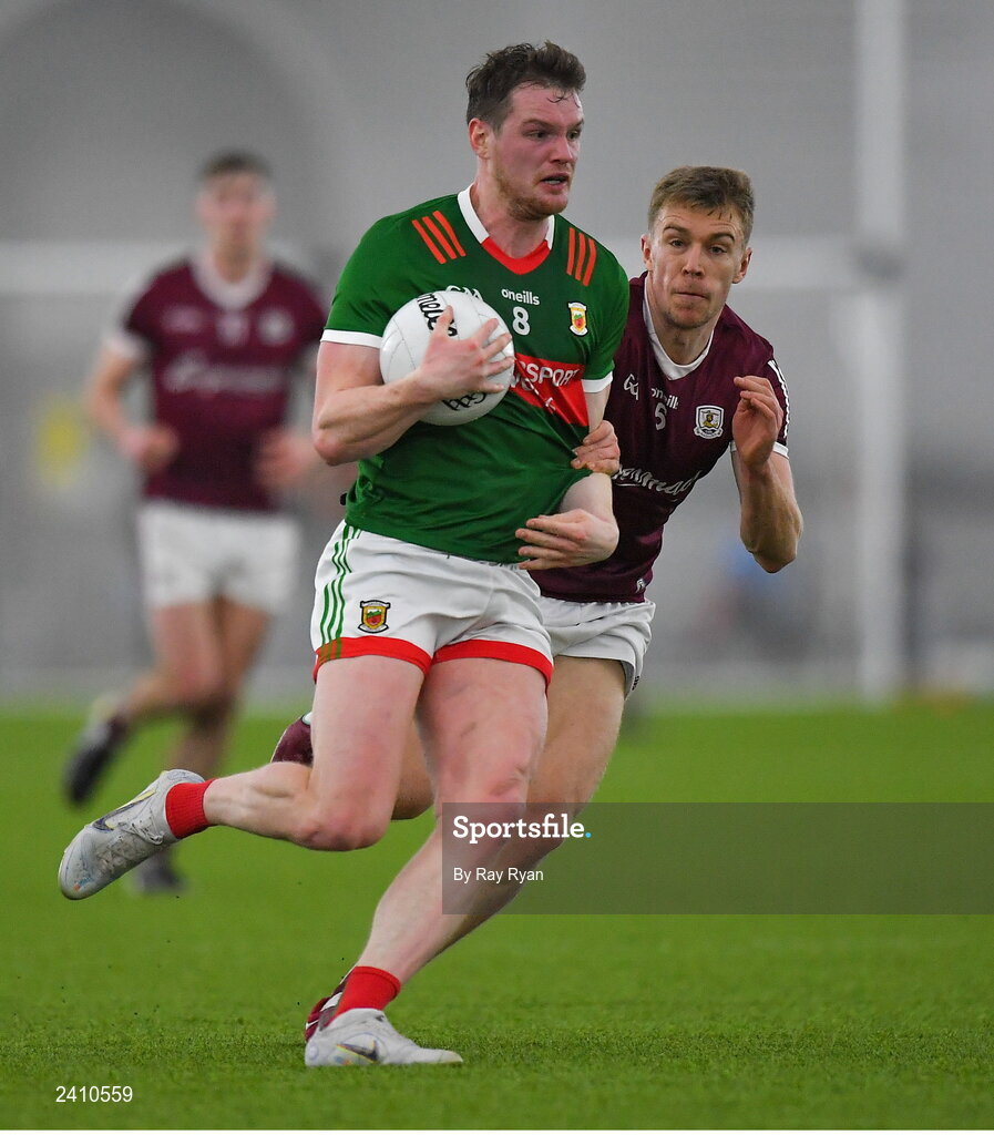 14 January 2023; Matthew Ruane of Mayo in action against Dylan McHugh of Galway during the Connacht FBD League Semi-Final match between Mayo and Galway at NUI Galway Connacht GAA Air Dome in Bekan, Mayo. Photo by Ray Ryan/Sportsfile