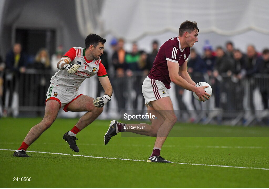 14 January 2023; Mathew Tierney of Galway rounds Mayo goalkeeper Rory Byrne on his way to score a goal for his side during the Connacht FBD League Semi-Final match between Mayo and Galway at NUI Galway Connacht GAA Air Dome in Bekan, Mayo. Photo by Ray Ryan/Sportsfile