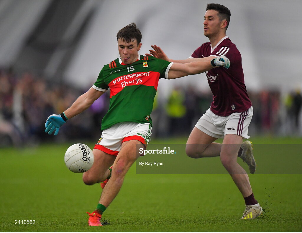14 January 2023; Paul Towey of Mayo in action against Ian Burke of Galway during the Connacht FBD League Semi-Final match between Mayo and Galway at NUI Galway Connacht GAA Air Dome in Bekan, Mayo. Photo by Ray Ryan/Sportsfile