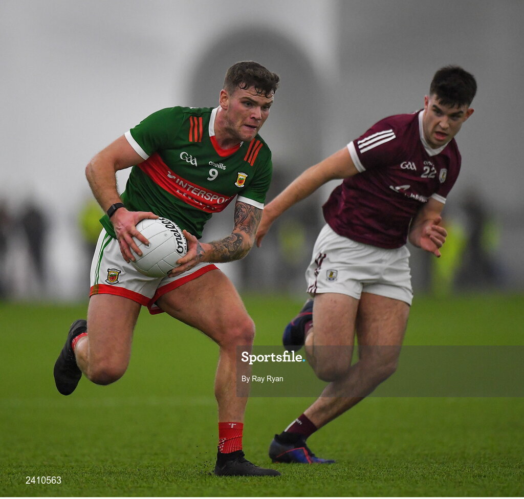 14 January 2023; Jordan Flynn of Mayo in action against Tomo Culhane of Galway during the Connacht FBD League Semi-Final match between Mayo and Galway at NUI Galway Connacht GAA Air Dome in Bekan, Mayo. Photo by Ray Ryan/Sportsfile
