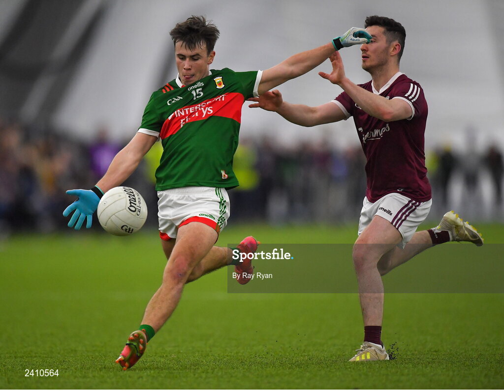 14 January 2023; Paul Towey of Mayo in action against Ian Burke of Galway during the Connacht FBD League Semi-Final match between Mayo and Galway at NUI Galway Connacht GAA Air Dome in Bekan, Mayo. Photo by Ray Ryan/Sportsfile