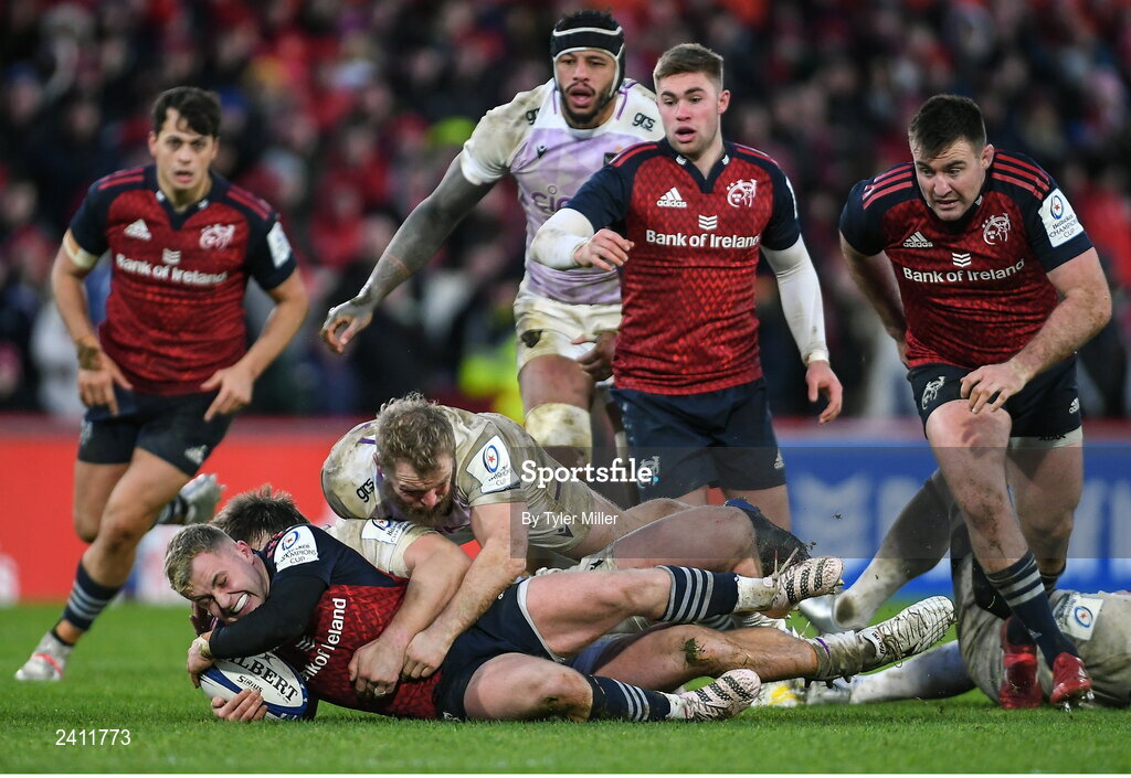 14 January 2023; Craig Casey of Munster is tackled by Mike Haywood, top, and Paul Hill of Northampton Saints during the Heineken Champions Cup Pool B Round 3 match between Munster and Northampton Saints at Thomond Park in Limerick. Photo by Tyler Miller/Sportsfile