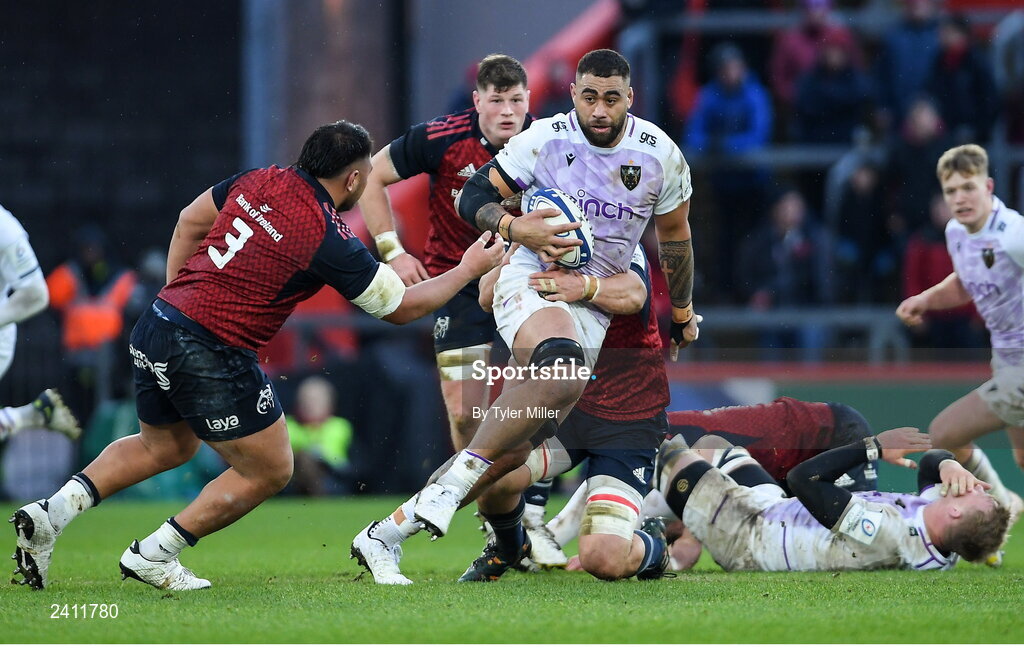 14 January 2023; Lukhan Salakaia-Loto of Northampton Saints is tackled by Gavin Coombes of Munster, hidden, during the Heineken Champions Cup Pool B Round 3 match between Munster and Northampton Saints at Thomond Park in Limerick. Photo by Tyler Miller/Sportsfile