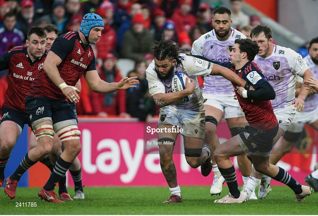 14 January 2023; Lewis Ludlam of Northampton Saints is tackled by Tadhg Beirne of Munster, left, and Joey Carbery of Munster during the Heineken Champions Cup Pool B Round 3 match between Munster and Northampton Saints at Thomond Park in Limerick. Photo by Tyler Miller/Sportsfile