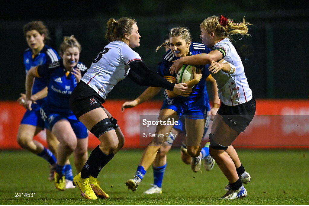 21 January 2023; Anna Doyle of Leinster is tackled by Fern Wilson, left, and India Daley of Ulster during the Vodafone Women’s Interprovincial Championship Round Three match between Ulster and Leinster at Queen’s Sport in Belfast. Photo by Ramsey Cardy/Sportsfile