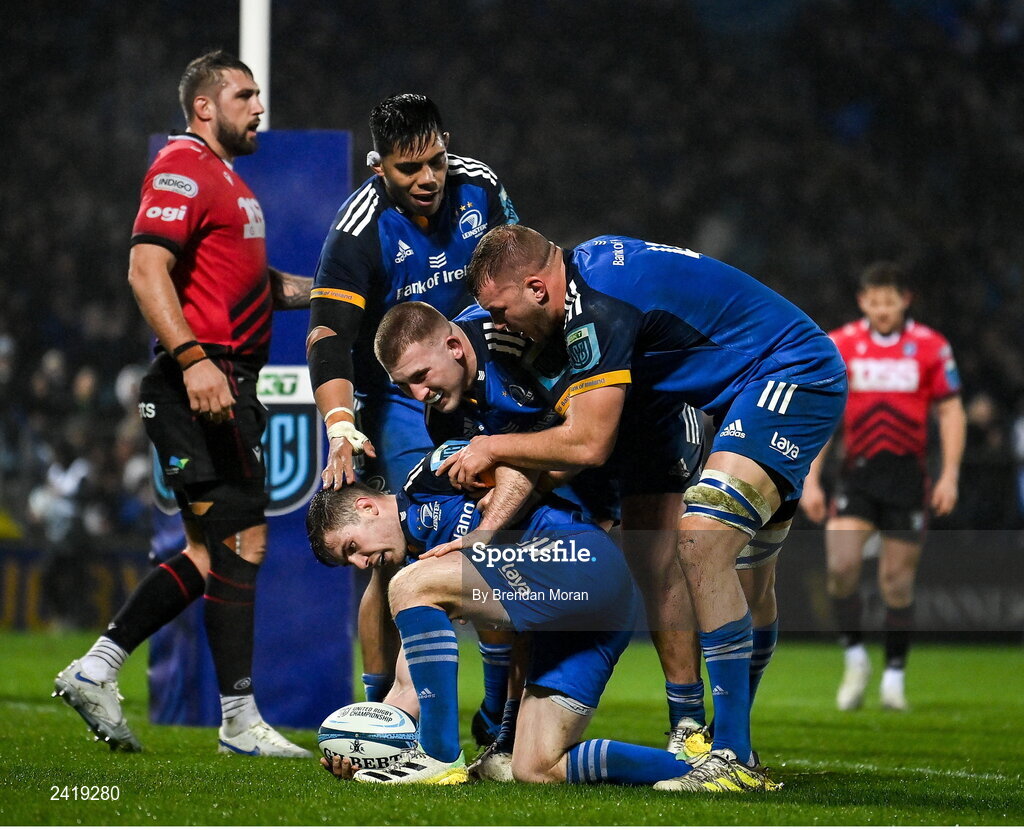 28 January 2023; Luke McGrath of Leinster celebrates with team-mates Michael Ala'alatoa, John McKee and Ross Molony after scoring his second and their side's third try during the United Rugby Championship match between Leinster and Cardiff at RDS Arena in Dublin. Photo by Brendan Moran/Sportsfile