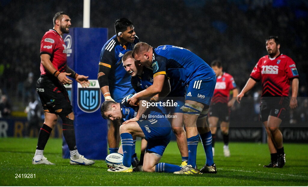 28 January 2023; Luke McGrath of Leinster celebrates with team-mates Michael Ala'alatoa, John McKee and Ross Molony after scoring his second and their side's third try during the United Rugby Championship match between Leinster and Cardiff at RDS Arena in Dublin. Photo by Brendan Moran/Sportsfile