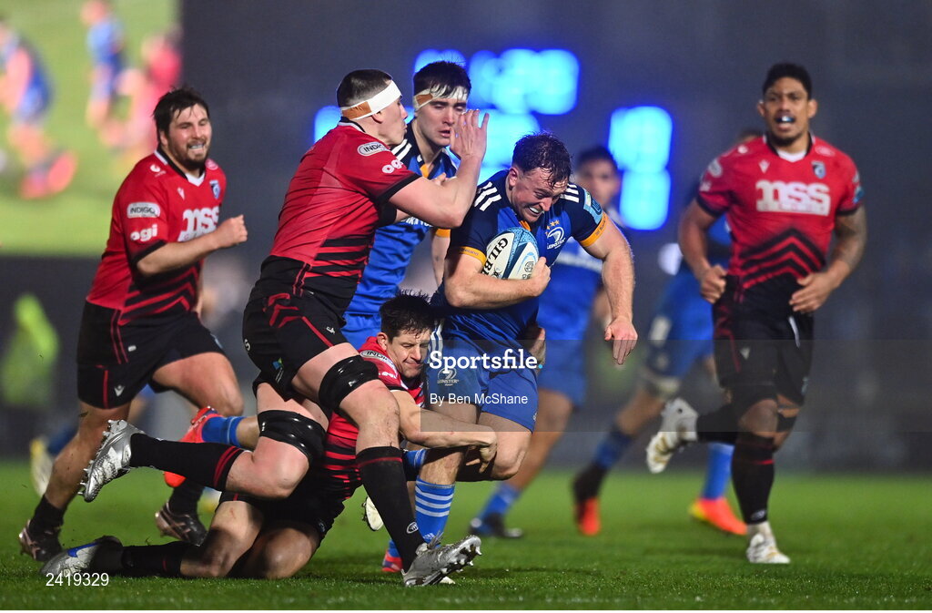 28 January 2023; Liam Turner of Leinster is tackled by Lloyd Williams, bottom, and Seb Davies of Cardiff during the United Rugby Championship match between Leinster and Cardiff at RDS Arena in Dublin. Photo by Ben McShane/Sportsfile
