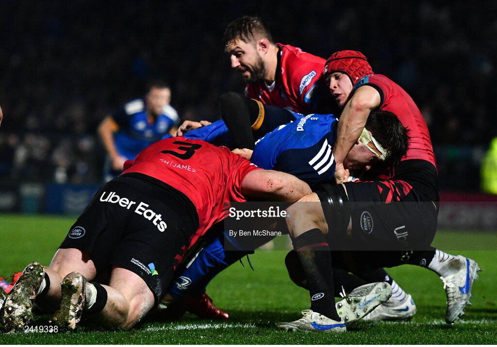 28 January 2023; Brian Deeny of Leinster on his way to scoring his side's fourth try, despite the tackles of Cardiff players, from left, Kieron Assiratti, Seb Davies and James Botham during the United Rugby Championship match between Leinster and Cardiff at RDS Arena in Dublin. Photo by Ben McShane/Sportsfile