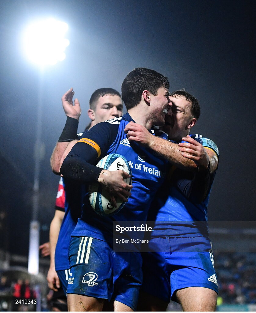 28 January 2023; Max O'Reilly of Leinster celebrates with teammates Liam Turner, right, and Scott Penny, left, after scoring their side's fourth try during the United Rugby Championship match between Leinster and Cardiff at RDS Arena in Dublin. Photo by Ben McShane/Sportsfile