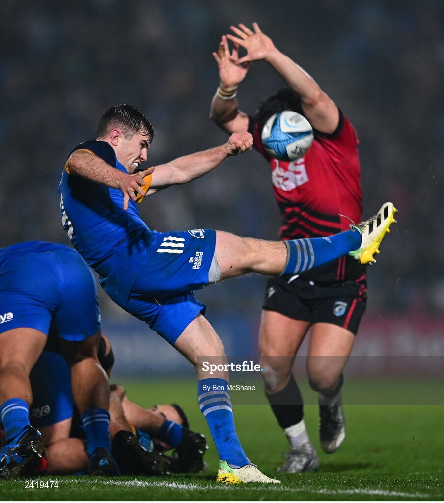 28 January 2023; Luke McGrath of Leinster kicks clear from Kirby Myhill of Cardiff during the United Rugby Championship match between Leinster and Cardiff at RDS Arena in Dublin. Photo by Ben McShane/Sportsfile