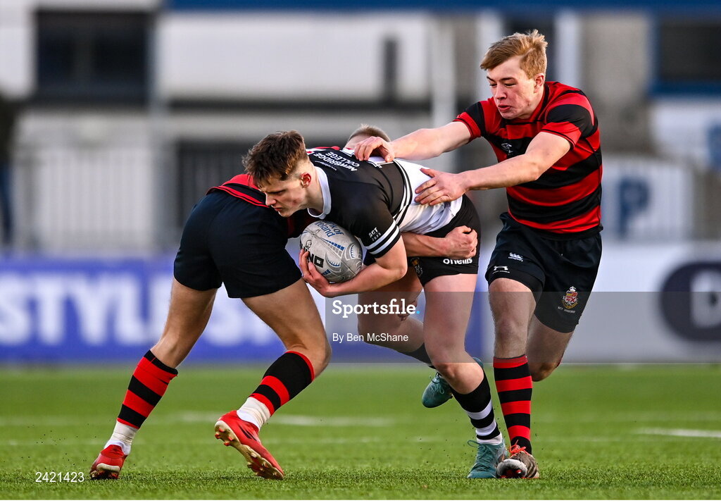 31 January 2023; Rory Allen of Newbridge College is tackled by Ivor Fenton, left, and Jasper Kelly of Kilkenny College during the Bank of Ireland Leinster Rugby Schools Senior Cup First Round match between Newbridge College and Kilkenny College at Energia Park in Dublin. Photo by Ben McShane/Sportsfile
