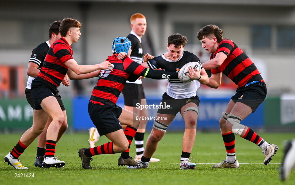 31 January 2023; Ronan McGroary of Newbridge College is tackled by George Wakeham, left, and Jake O'Sullivan of Kilkenny College during the Bank of Ireland Leinster Rugby Schools Senior Cup First Round match between Newbridge College and Kilkenny College at Energia Park in Dublin. Photo by Ben McShane/Sportsfile