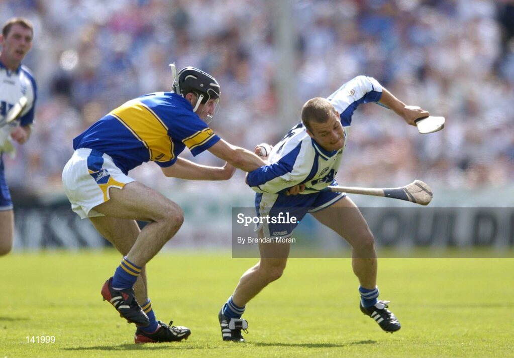 6 June 2004; Eoin McGrath, Waterford, holds possession despite being tackled by Thomas Costello, Tipperary. Guinness Munster Senior Hurling Championship semi-final, Tipperary v Waterford, Pairc Ui Chaoimh, Cork. Picture credit; Brendan Moran / SPORTSFILE