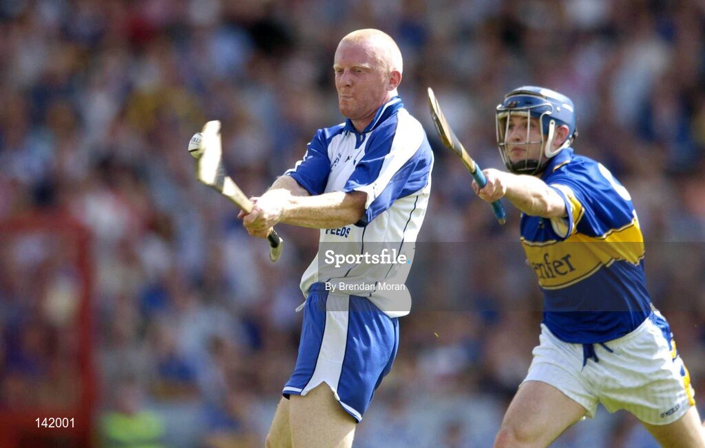 6 June 2004; John Mullane, Waterford, scores his sides third goal despite the attentions of Paul Kelly, Tipperary. Guinness Munster Senior Hurling Championship semi-final, Tipperary v Waterford, Pairc Ui Chaoimh, Cork. Picture credit; Brendan Moran / SPORTSFILE