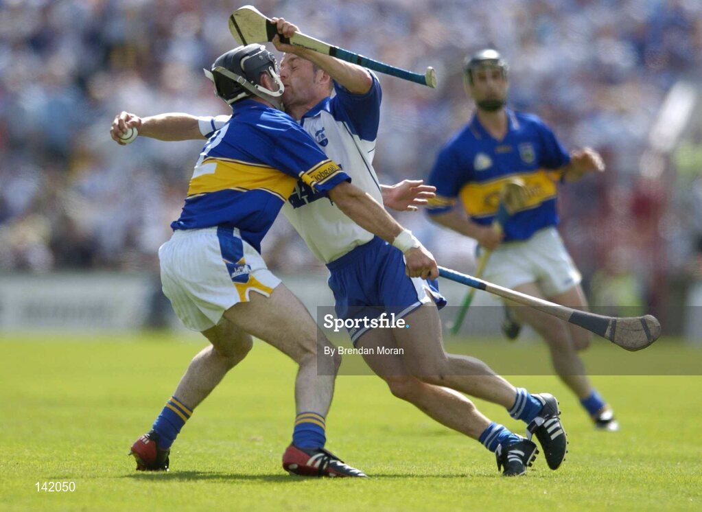 6 June 2004; Eoin McGrath, Waterford, is tackled by Thomas Costello, Tipperary. Guinness Munster Senior Hurling Championship semi-final, Tipperary v Waterford, Pairc Ui Chaoimh, Cork. Picture credit; Brendan Moran / SPORTSFILE
