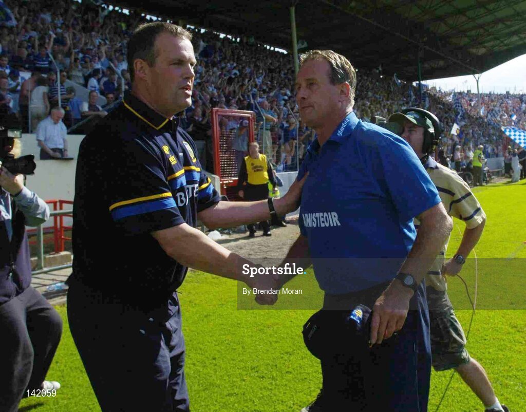 6 June 2004; Tipperary manager Ken Hogan, left, congratulates Waterford manager Justin McCarthy at the end of the game. Guinness Munster Senior Hurling Championship Semi-Final, Tipperary v Waterford, Pairc Ui Chaoimh, Cork. Picture credit; Brendan Moran / SPORTSFILE