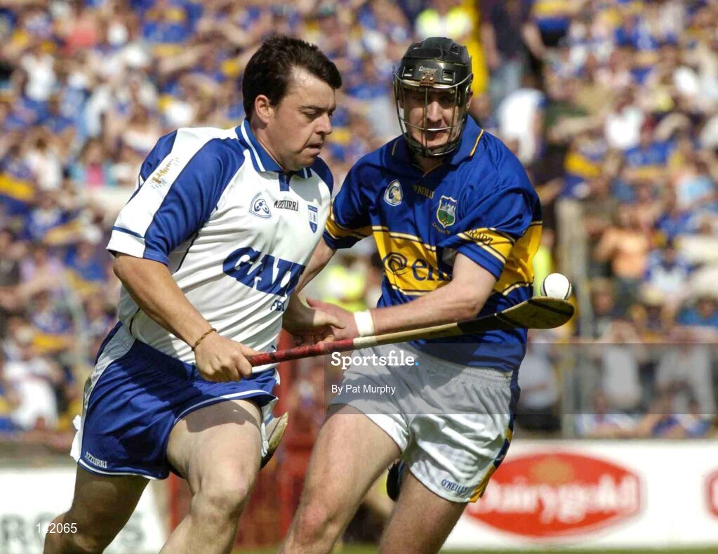 6 June 2004; Paul Flynn, Waterford, in action against Tipperary's Paul Curran. Guinness Munster Senior Hurling Championship Semi-Final, Tipperary v Waterford, Pairc Ui Chaoimh, Cork. Picture credit; Pat Murphy / SPORTSFILE