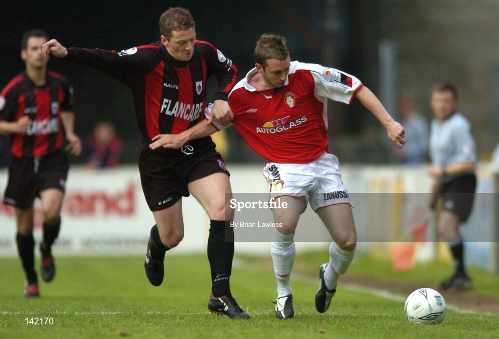 8 June 2004; Aidan O'Keeffe, St. Patrick's Athletic, in action against Vinny Perth, Longford Town. eircom League, Premier Division, Richmond Park, Dublin. Picture credit; Brian Lawless / SPORTSFILE