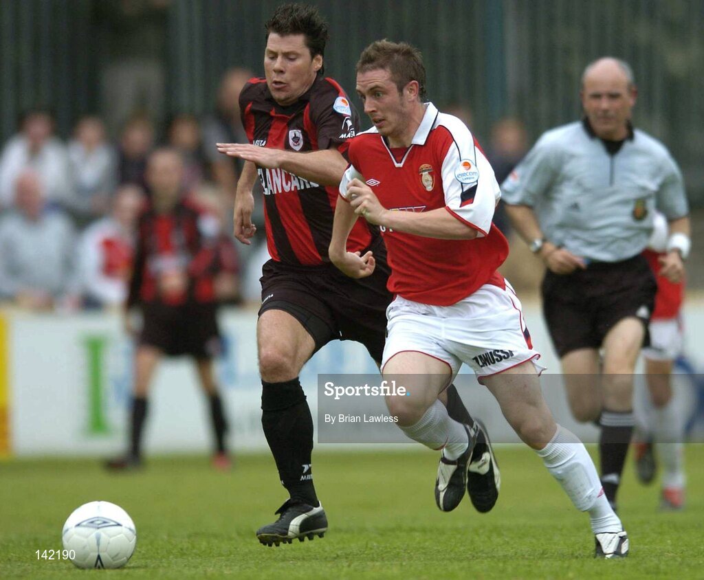 8 June 2004; Aidan O'Keeffe, St. Patrick's Athletic, in action against Dean Fitzgerald, Longford Town. eircom League, Premier Division, Richmond Park, Dublin. Picture credit; Brian Lawless / SPORTSFILE