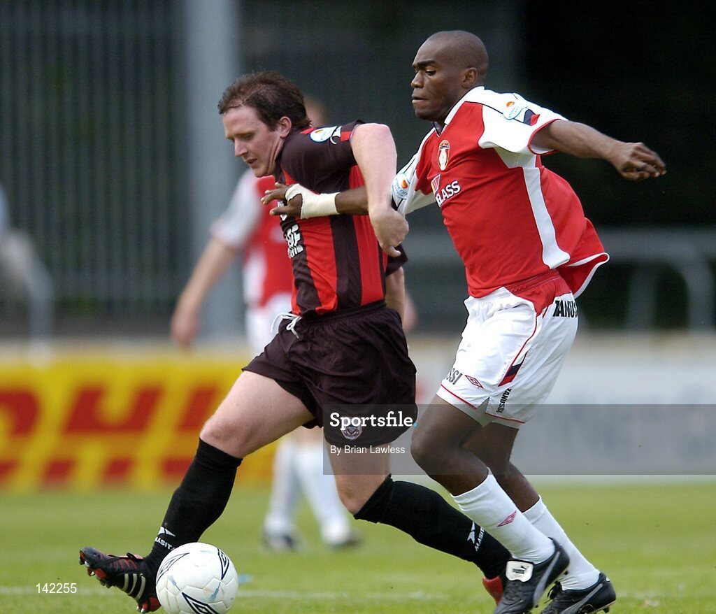 8 June 2004; Dessie Baker, Longford Town, in action against Joseph Ndo, St. Patrick's Athletic. eircom League, Premier Division, Richmond Park, Dublin. Picture credit; Brian Lawless / SPORTSFILE