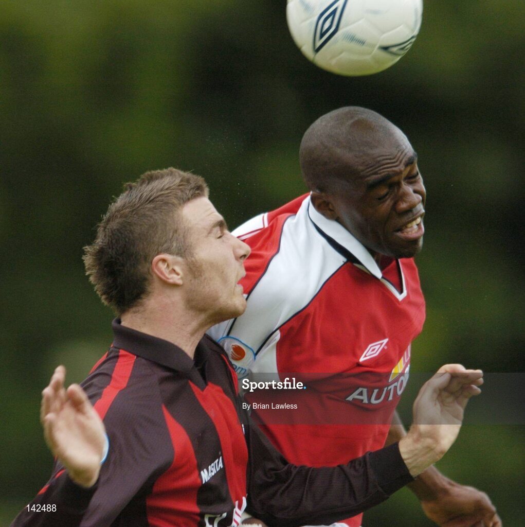 8 June 2004; Joseph Ndo, St. Patrick's Athletic, in action against Sean Dillon, Longford Town. eircom League, Premier Division, St. Patrick's Athletic v Longford, Richmond Park, Dublin. Picture credit; Brian Lawless / SPORTSFILE