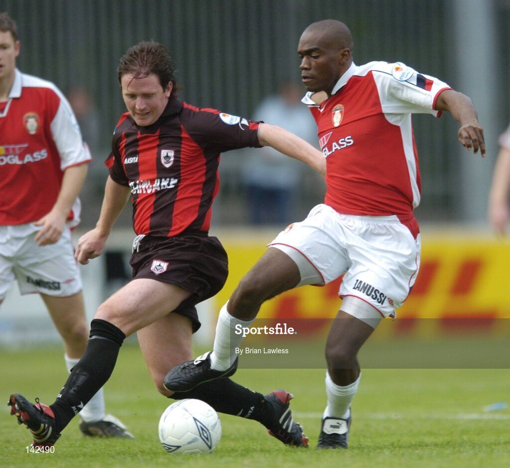 8 June 2004; Joseph Ndo, St. Patrick's Athletic, in action against Dessie Baker, Longford Town. eircom League, Premier Division, St. Patrick's Athletic v Longford, Richmond Park, Dublin. Picture credit; Brian Lawless / SPORTSFILE