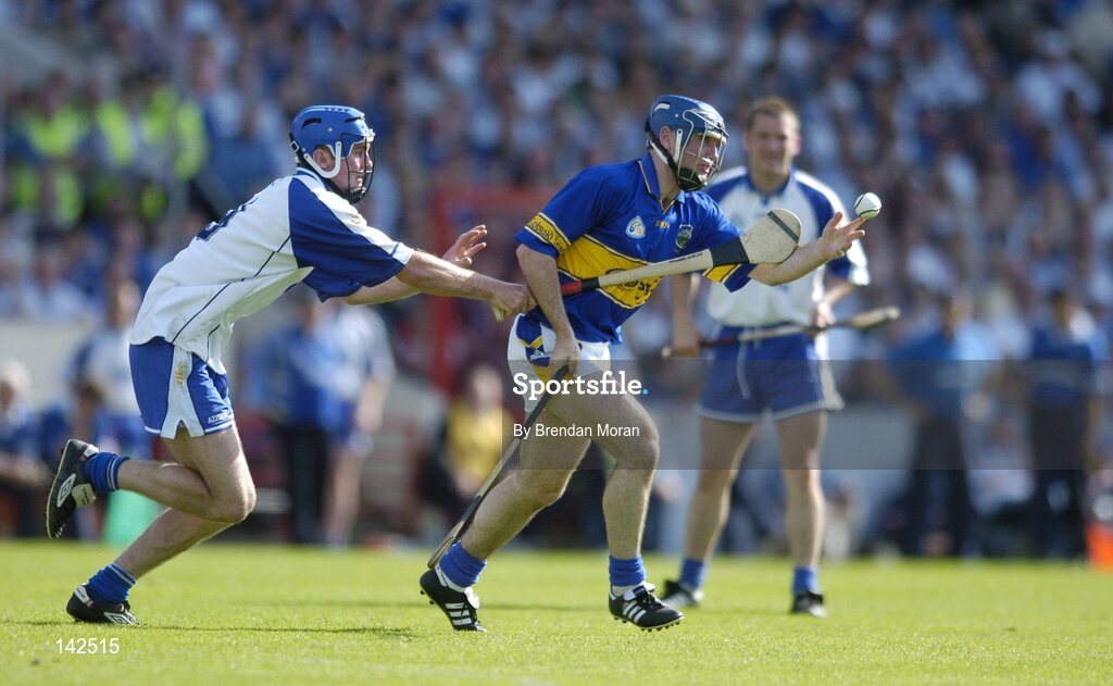 6 June 2004; Eoin Kelly, Tipperary, in action against Michael Walsh, Waterford. Guinness Munster Senior Hurling Championship semi-final, Tipperary v Waterford, Pairc Ui Chaoimh, Cork. Picture credit; Brendan Moran / SPORTSFILE