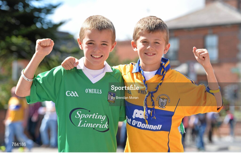 18 August 2013; Twins Ryan, left, and Jason Power, from Ennis, Co. Clare, but whose mother Bernie is from Mungret, Co.Limerick, show their support for their respective sides before the game. GAA Hurling All-Ireland Senior Championship, Semi-Final, Limerick v Clare, Croke Park, Dublin. Picture credit: Brendan Moran / SPORTSFILE