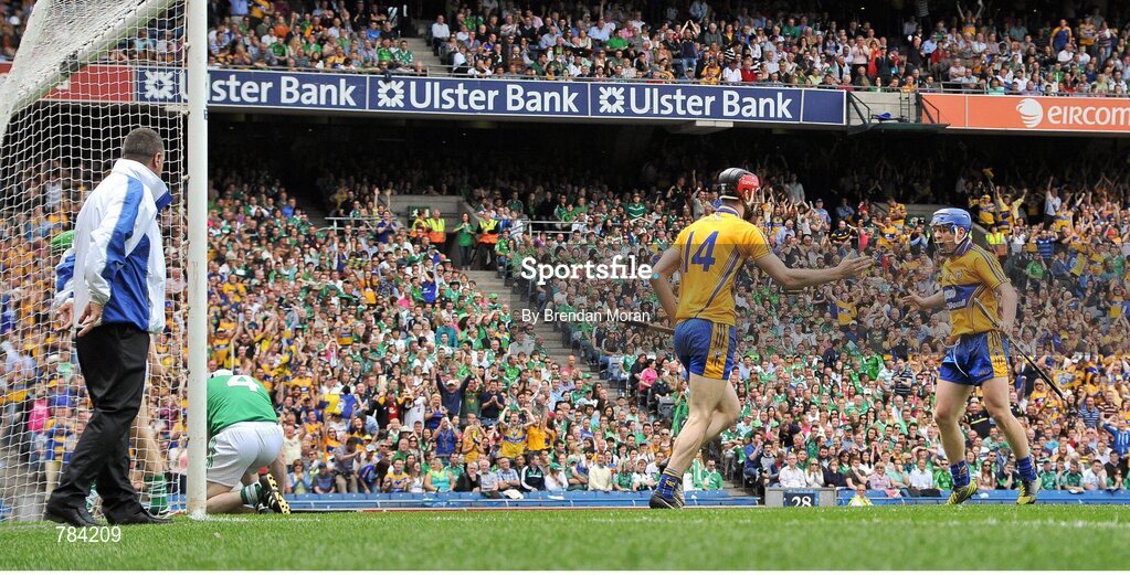 18 August 2013; Darach Honan, 14, and Padraic Collins, Clare, celebrate after their side's only goal as Limerick's Tom Condon looks dejected. GAA Hurling All-Ireland Senior Championship, Semi-Final, Limerick v Clare, Croke Park, Dublin. Picture credit: Brendan Moran / SPORTSFILE