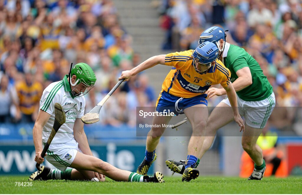18 August 2013; The sliothar goes through the legs of Limerick goalkeeper Nickie Quaid before ending up in the back of the net for Clare's only goal, as Clare's Pádraic Collins and Limerick's Richie McCarthy close in. GAA Hurling All-Ireland Senior Championship, Semi-Final, Limerick v Clare, Croke Park, Dublin. Picture credit: Brendan Moran / SPORTSFILE