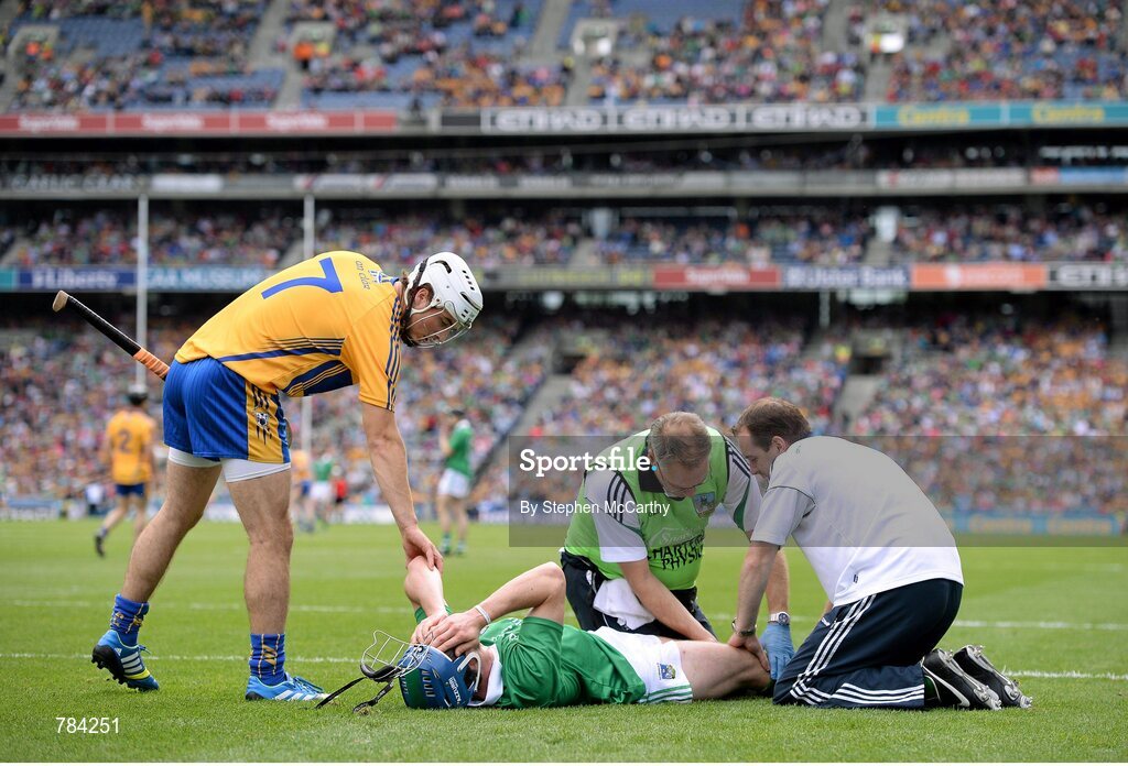 18 August 2013; Seamus Hickey, Limerick, is attended to during the first half after picking up an injury, as Patrick O'Connor, Clare, checks on his well-being. GAA Hurling All-Ireland Senior Championship, Semi-Final, Limerick v Clare, Croke Park, Dublin. Picture credit: Stephen McCarthy / SPORTSFILE