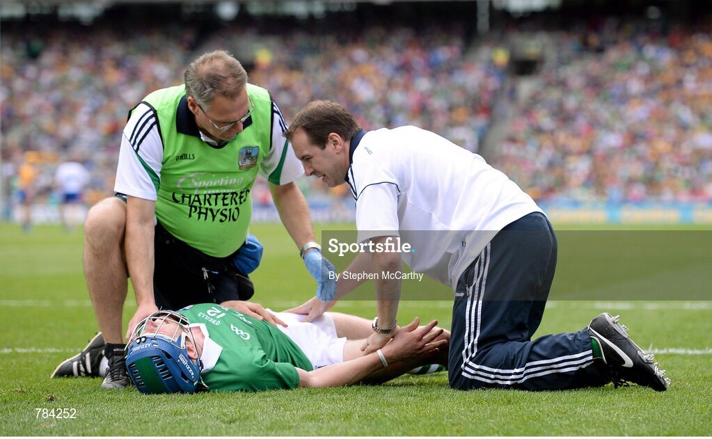 18 August 2013; Seamus Hickey, Limerick, is attended to during the first half after picking up an injury. GAA Hurling All-Ireland Senior Championship, Semi-Final, Limerick v Clare, Croke Park, Dublin. Picture credit: Stephen McCarthy / SPORTSFILE