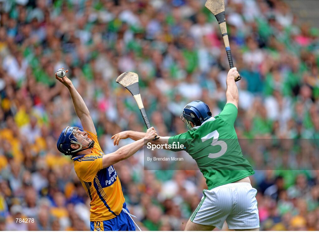 18 August 2013; Pádraic Collins, Clare, catches the sliothar ahead of Richie McCarthy, Limerick. GAA Hurling All-Ireland Senior Championship, Semi-Final, Limerick v Clare, Croke Park, Dublin. Picture credit: Brendan Moran / SPORTSFILE