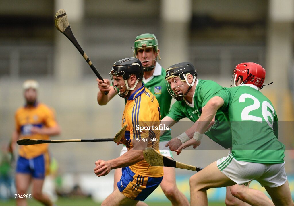 18 August 2013; Domhnall O'Donovan, Clare, in action against Niall Moran, left, Wayne McNamara and Thomas Ryan, right, Limerick. GAA Hurling All-Ireland Senior Championship, Semi-Final, Limerick v Clare, Croke Park, Dublin. Photo by Sportsfile