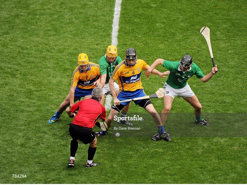 18 August 2013; Referee Johnny Ryan throws the ball in at the start of the game between Colm Galvin, left, and Patrick Donnellan, Clare, and Paul Browne, left, and Donal O'Grady, Limerick. GAA Hurling All-Ireland Senior Championship, Semi-Final, Limerick v Clare, Croke Park, Dublin. Picture credit: Dáire Brennan / SPORTSFILE