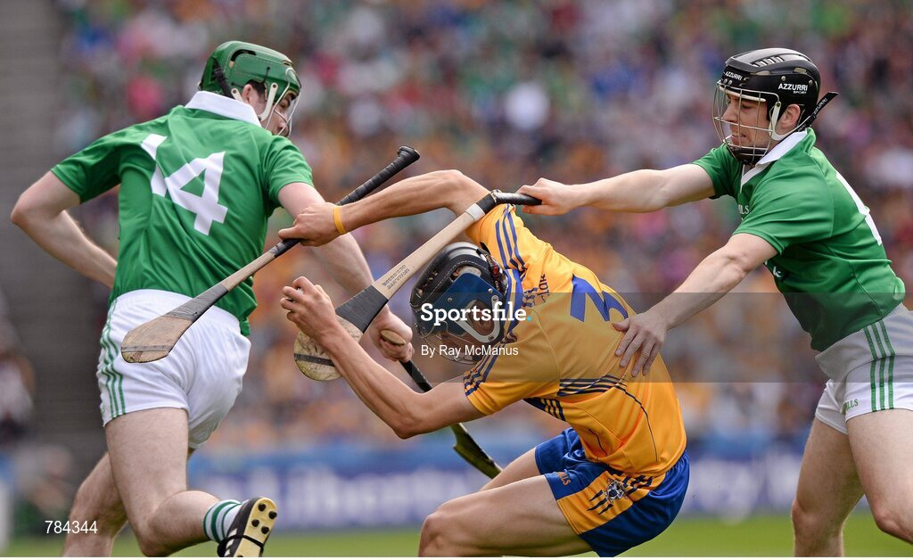 18 August 2013; Clare full back David McInerney is tackled by Graeme Mulcahy, right, and Declan Hannon, Limerick. GAA Hurling All-Ireland Senior Championship, Semi-Final, Limerick v Clare, Croke Park, Dublin. Picture credit: Ray McManus / SPORTSFILE