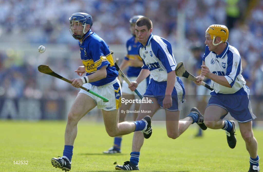 6 June 2004; Benny Dunne, Tipperary, in action against Brian Phelan and Eoin Murphy, right, Waterford. Guinness Munster Senior Hurling Championship semi-final, Tipperary v Waterford, Pairc Ui Chaoimh, Cork. Picture credit; Brendan Moran / SPORTSFILE