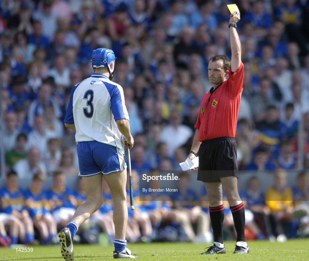 6 June 2004; Declan Prendergast, Waterford, is shown the yellow card by referee Diarmuid Kirwan. Guinness Munster Senior Hurling Championship semi-final, Tipperary v Waterford, Pairc Ui Chaoimh, Cork. Picture credit; Brendan Moran / SPORTSFILE